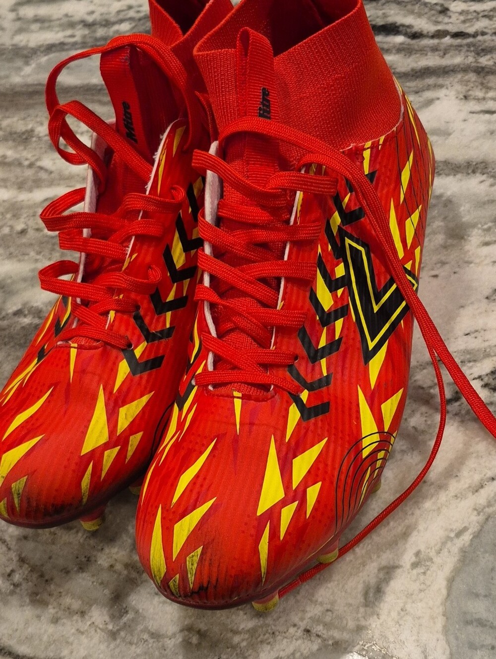 Men's Red Athletic Soccer Cleats with Yellow Accents